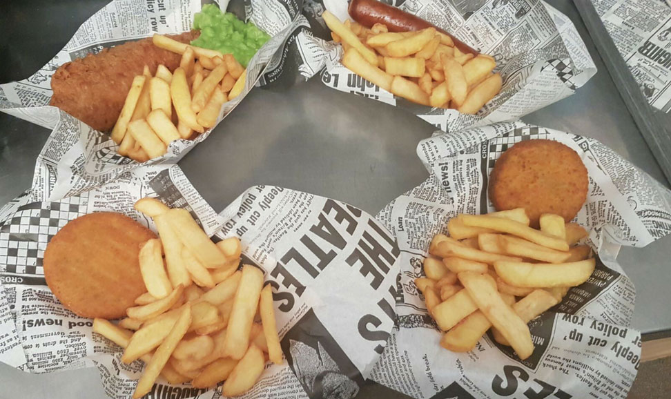 fish and chip meal in traditional newspaper print paper