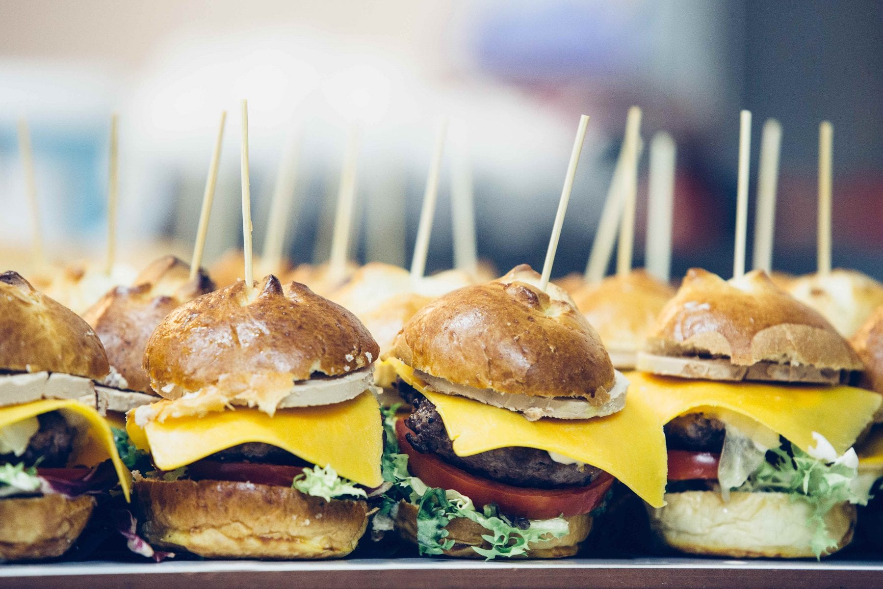 Close up of mini burger with cheese and salad on a delicious bread spanish tapas ready to serve
