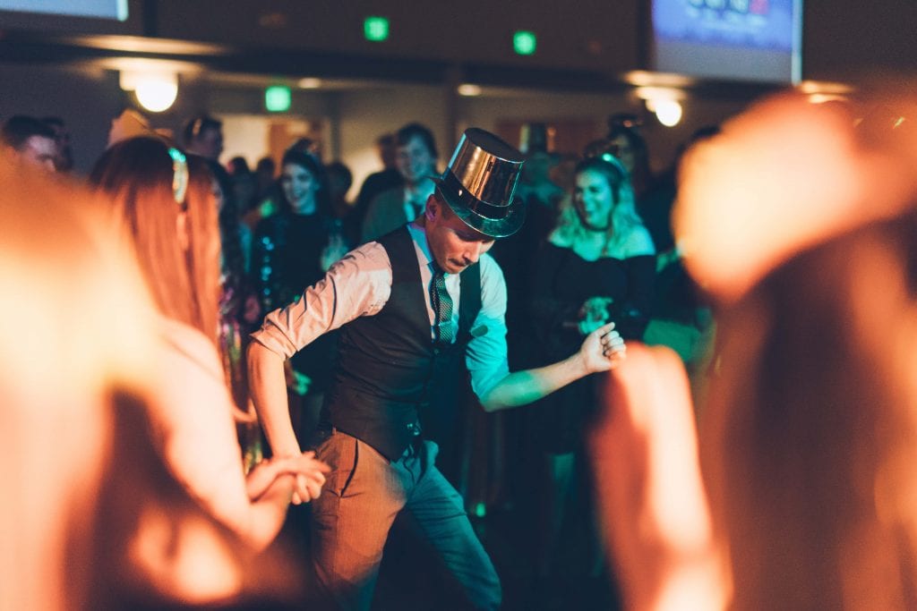 Man Dancing In Top Hat At Wedding Party