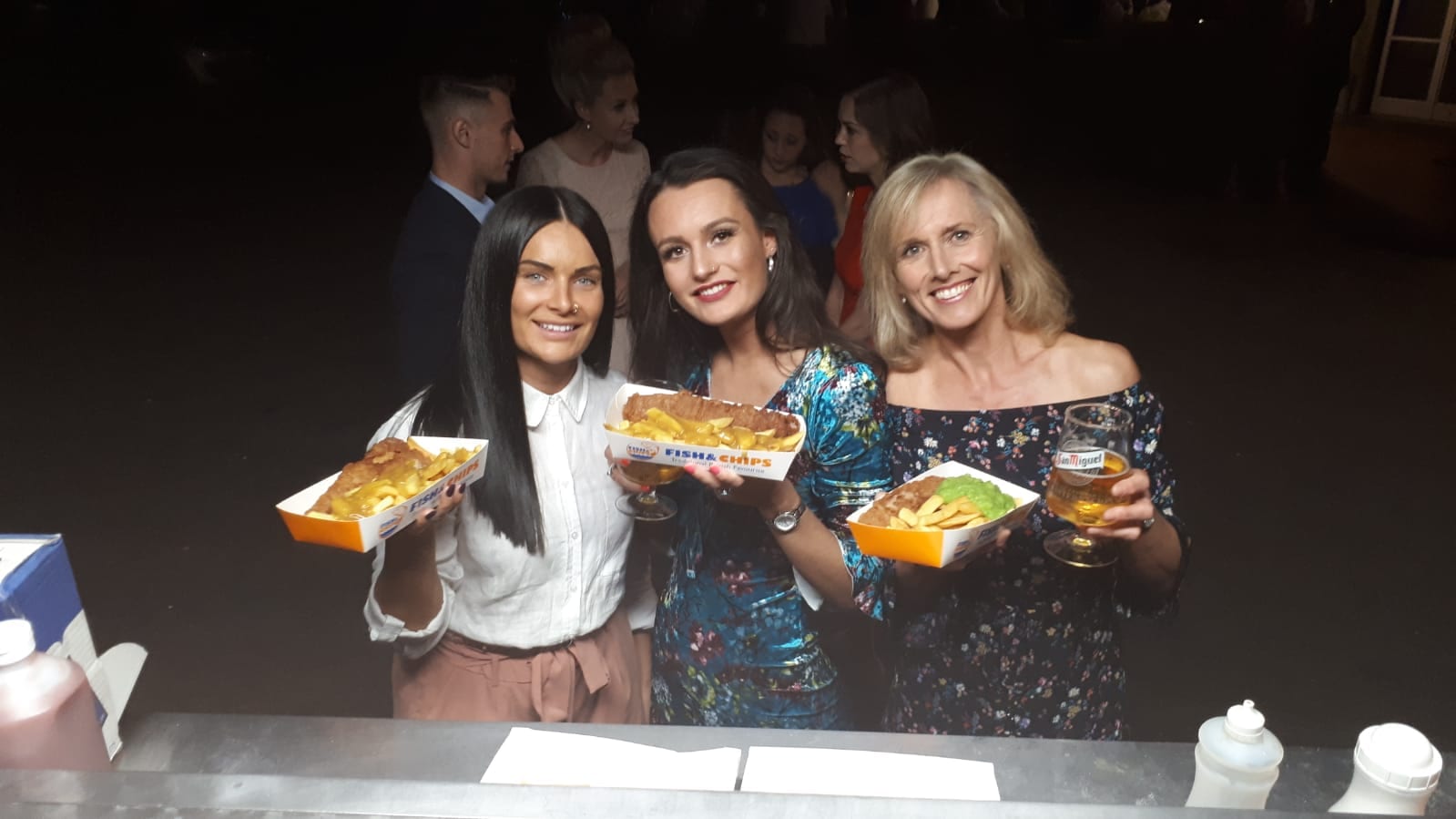 Three ladies with fish and chips 