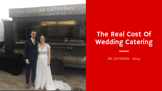 Couple standing in front of pizza van