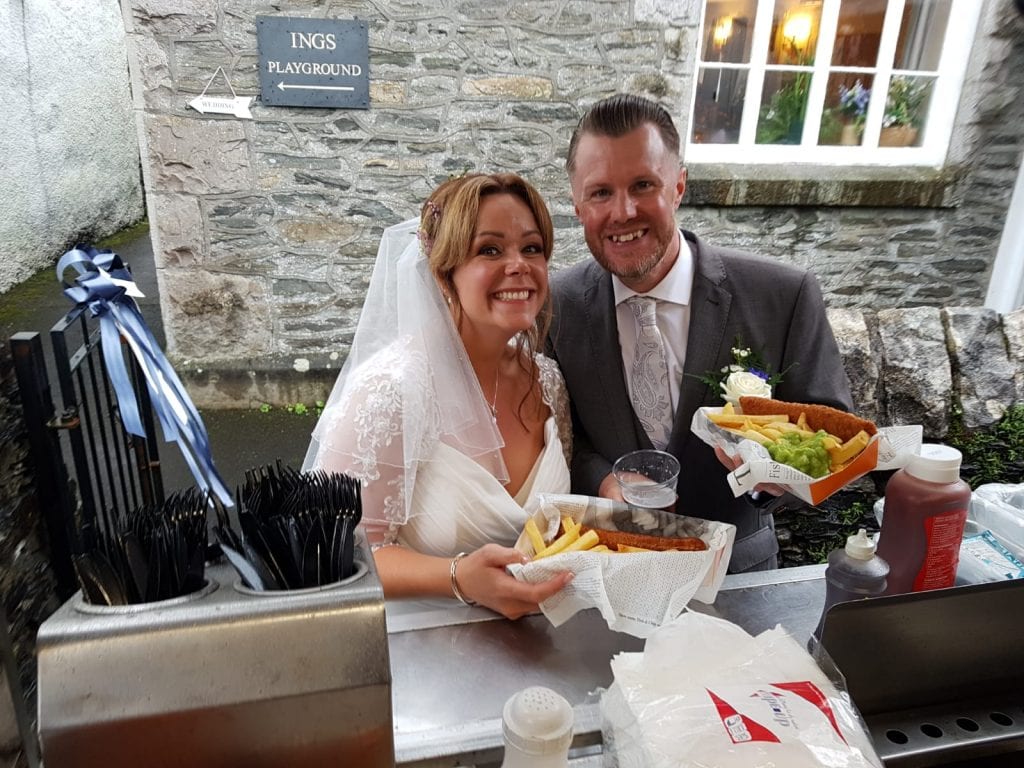 Wedding couple enjoy fish and chips - kkcatering 