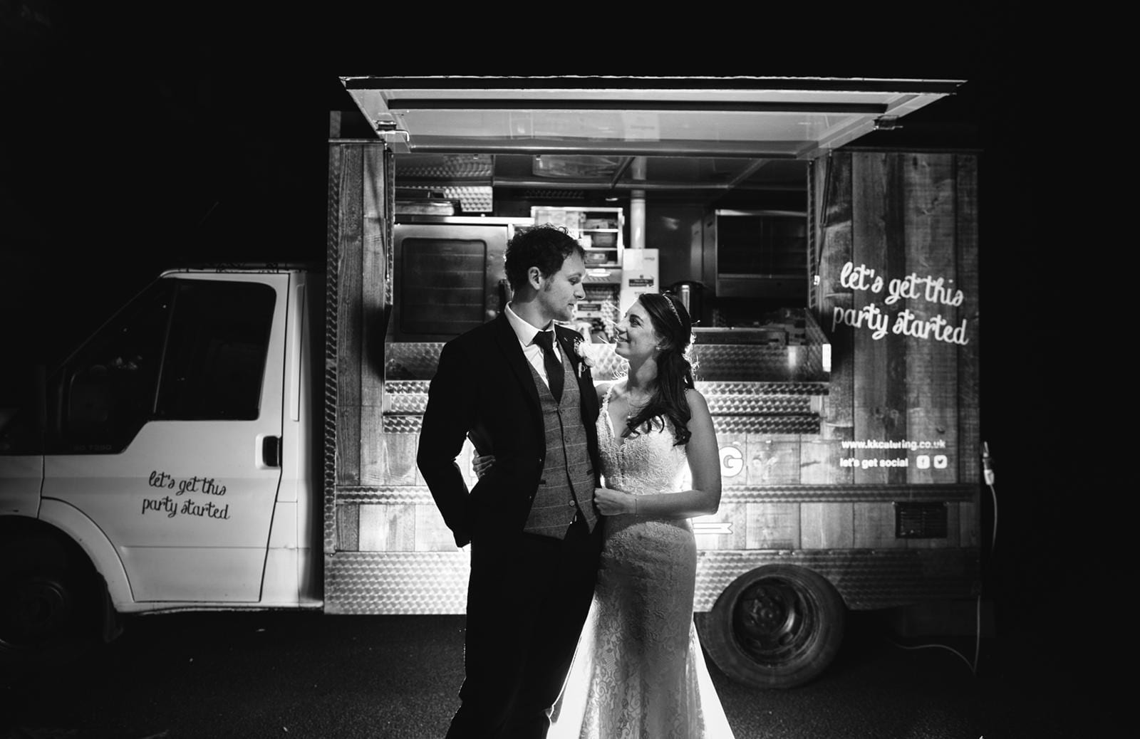 Couple stand in fron of fish and chip van