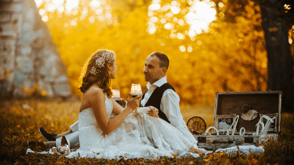 bride and groom sat in woodland