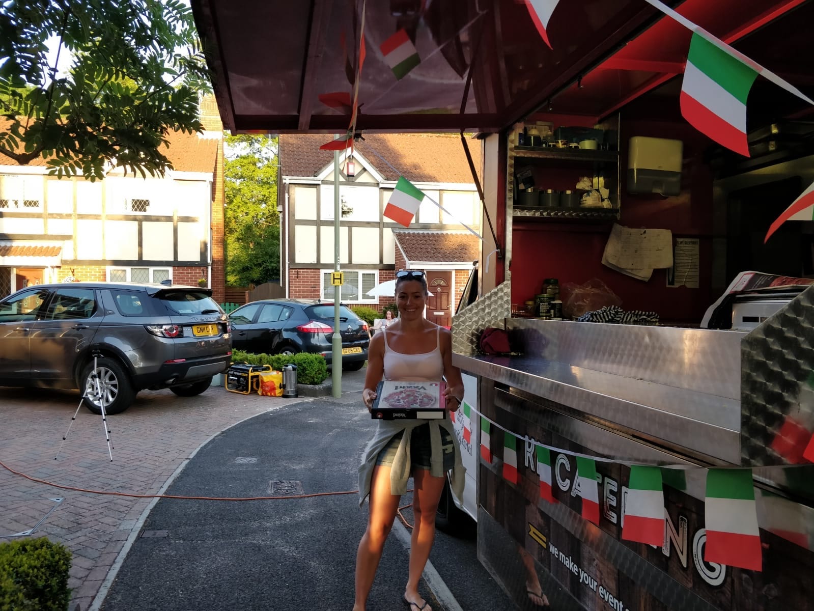 pizza van parked on a street