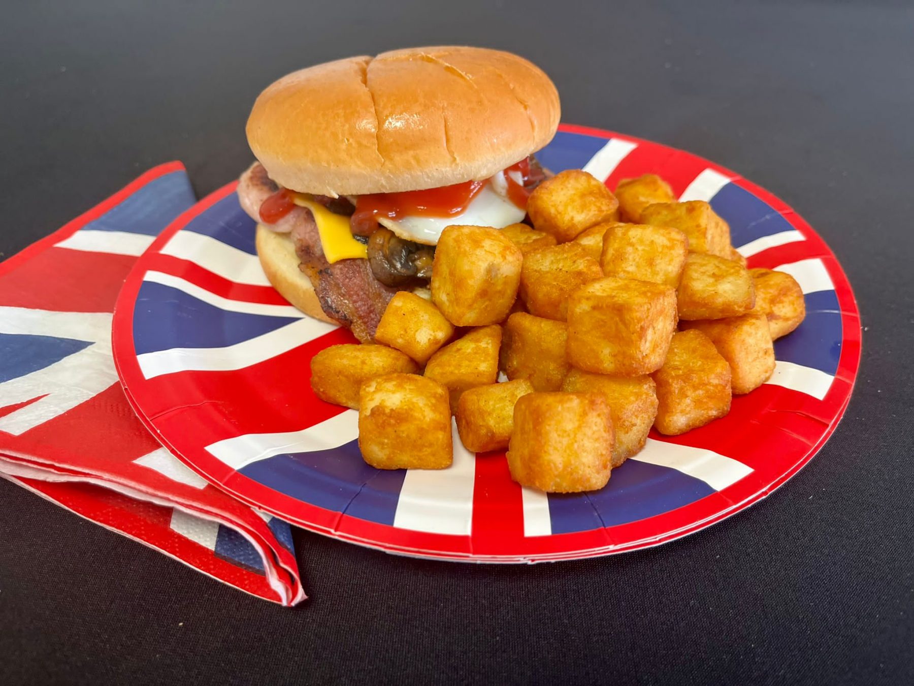 a bacon and eff bap from kk catering on a union jack plate